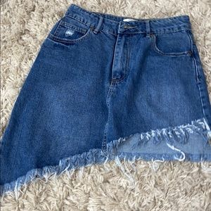 A denim asymmetrical mini skirt